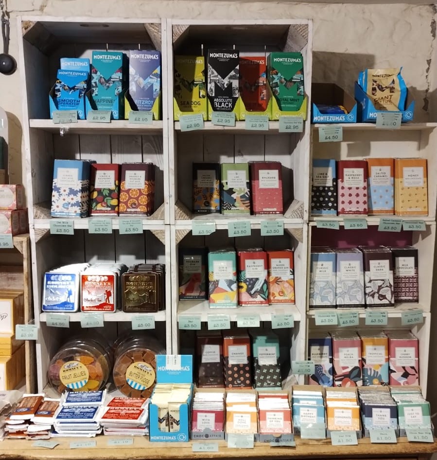 Chocolate bars vertically stacked on shelves