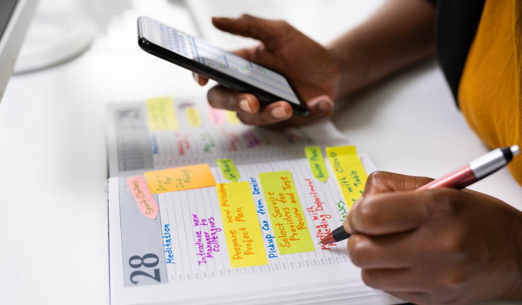 A person planning in a diary